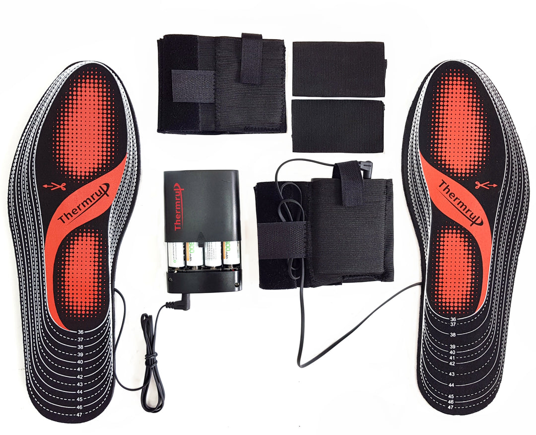 Heated insoles with battery compartments