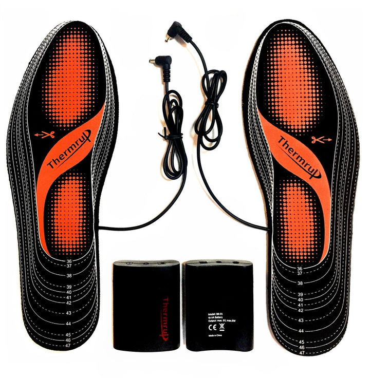 Heated insoles with battery compartments